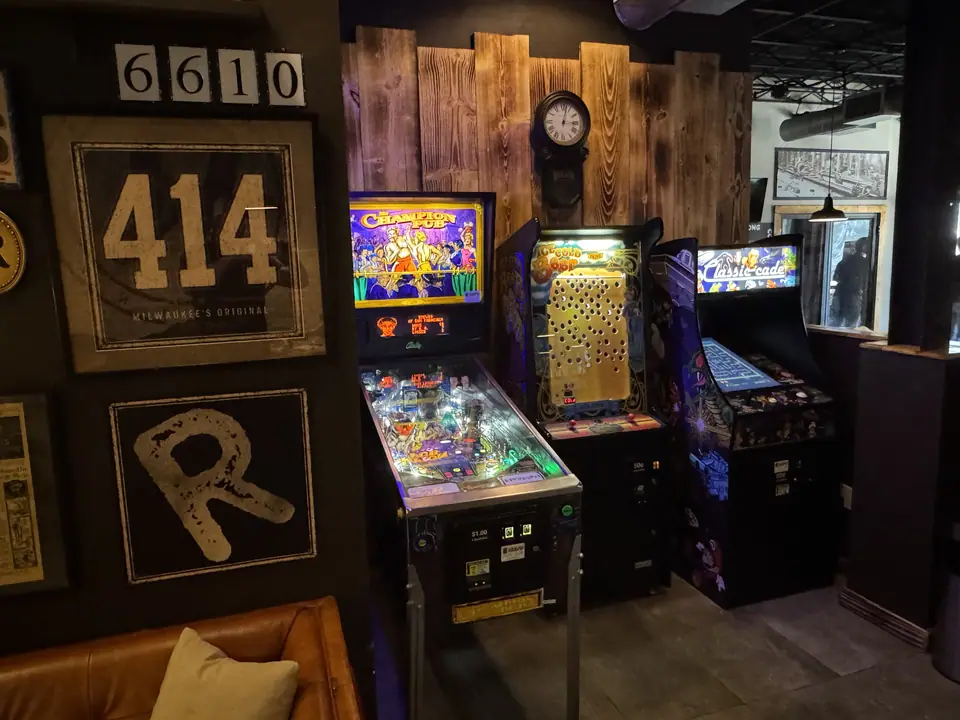 Classic pinball and arcade games beside the new lounge seating.