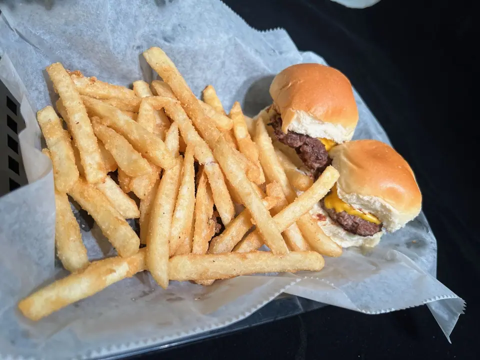 I'm Going to the Arcade: two kid-size smash burgers with seasoned fries in a paper-lined basket.